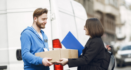 a delivery man handling a package