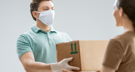 a delivery man handling a package