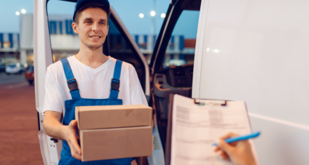 a delivery man handling a package