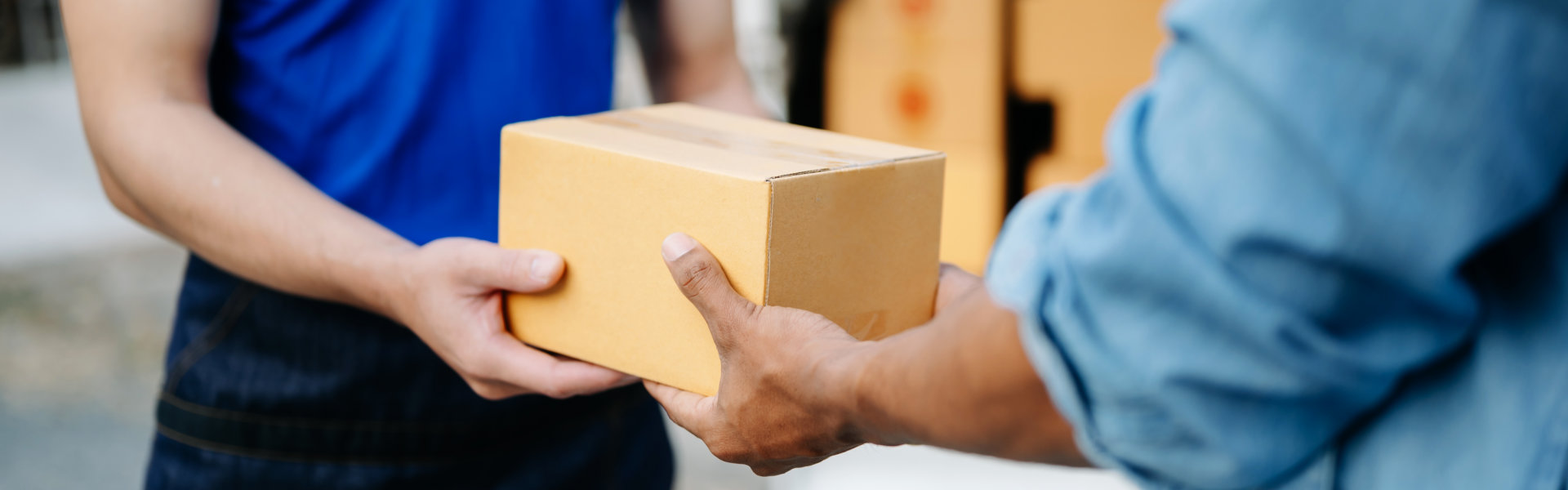 a person handing a package